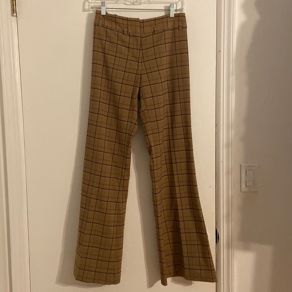 Women’s Hennes Collection bell bottom pants. Tan with pattern. Size 6
